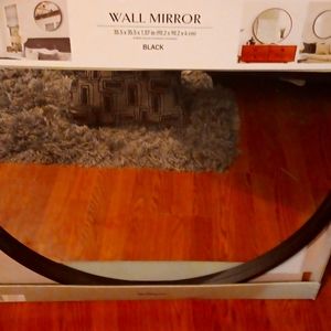 A black wall mirror